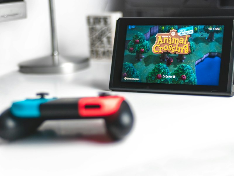 Controller and open notebook on a desk